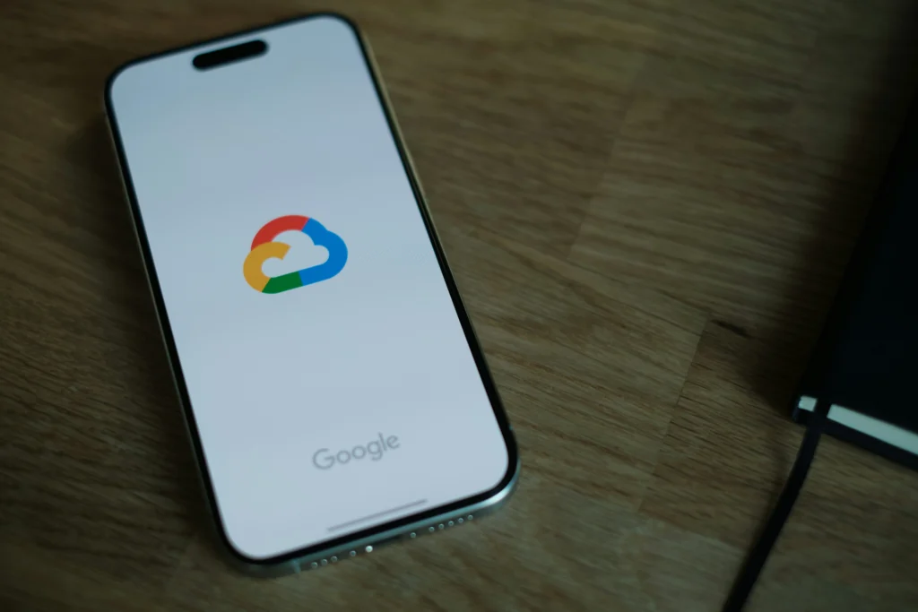 A mobile phone with the google cloud icon on